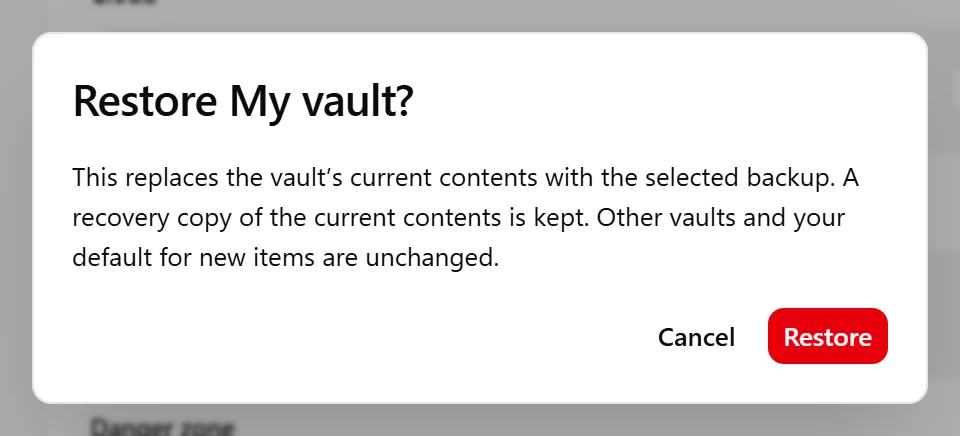 Restore confirmation explaining that the selected backup replaces the vault’s contents and a recovery copy is kept.